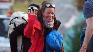 Norwegian climber Kristin Harila, 37, left, waves after arriving in Kathmandu, Nepal, Thursday, May 4, 2023. Harila who just became the fastest female climber to scale the 14 highest mountains in the world is now aiming to become the fastest person to complete the feat, beating a record set by a male climber in 2019.