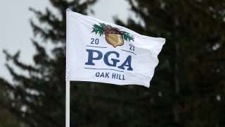 A PGA Championship flag blows in the breeze during a practice round prior to the 2023 PGA Championship at Oak Hill Country Club on May 17, 2023 in Rochester, N.Y.