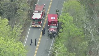 First responders at the scene of a single-vehicle crash off Lowell Road in Concord, Massachusetts, on Monday, May 1, 2023.