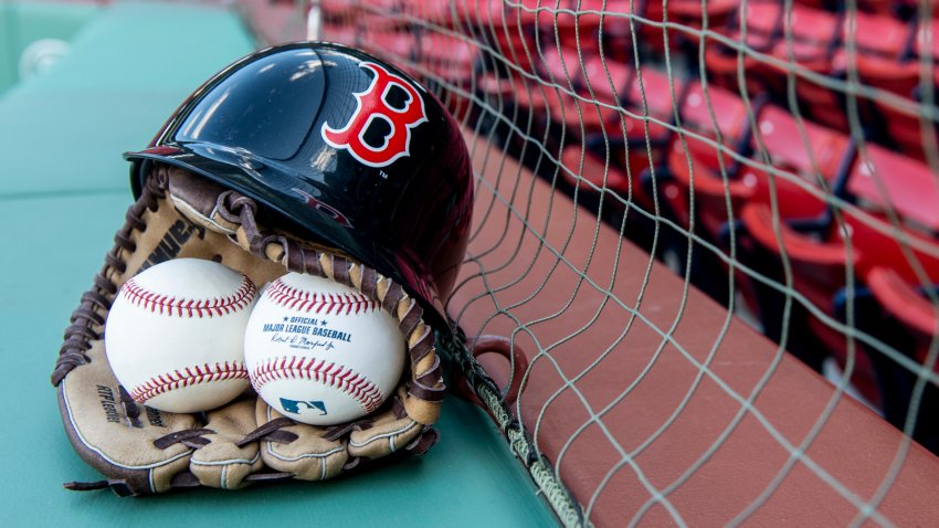 BOSTON, MA – APRIL 26: In this photo illustration, a Boston Red Sox helmet, baseball glove, and baseballs are shown April 26, 2018 at Fenway Park in Boston, Massachusetts. (Photo Illustration by Billie Weiss/Boston Red Sox/Getty Images)