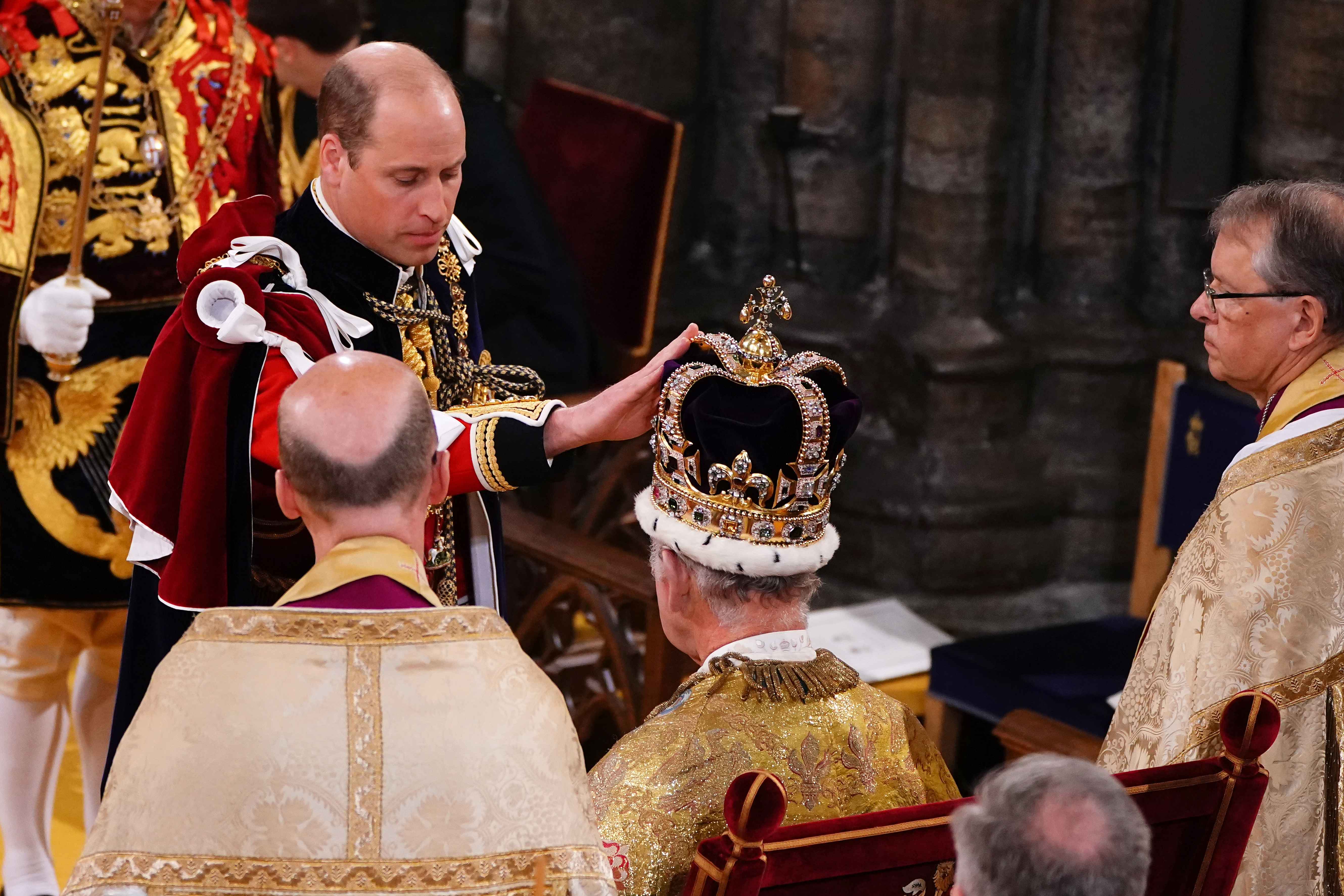 Prince William, Prince of Wales touches the St Edward’s Crown his father’s, King Charles III during the King’s Coronation Ceremony inside Westminster Abbey on May 6, 2023 in London.