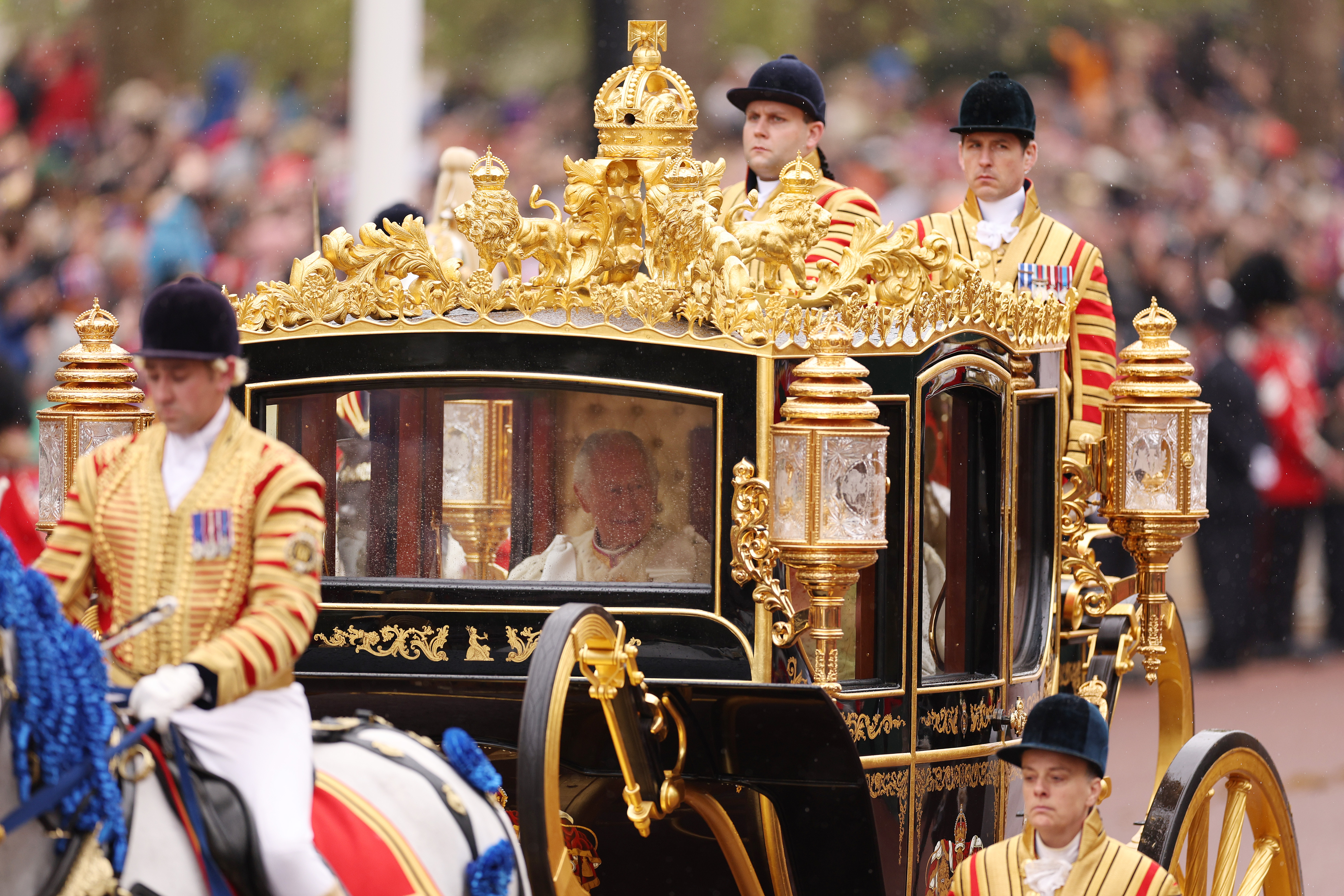 King Charles III travelling in the Diamond Jubilee Coach built in 2012 to commemorate the 60th anniversary of the reign of Queen Elizabeth II, flanked by over a thousand Armed Forces route liners and The Sovereign’s Escort of the Household Cavalry sets off along the Mall from Buckingham Palace on route to Westminster Abbey for the Coronation of King Charles III and Queen Camilla on May 6, 2023, in London, England.