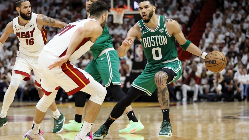 May 23, 2023; Miami, Florida, USA; Boston Celtics forward Jayson Tatum (0) controls the ball against Miami Heat guard Max Strus (31) in the third quarter during game four of the Eastern Conference Finals for the 2023 NBA playoffs at Kaseya Center. Mandatory Credit: Sam Navarro-USA TODAY Sports
