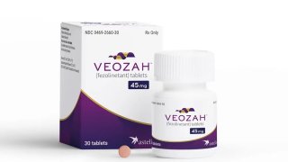 In this undated product photo released by Astellas Pharma, a box and container of Veozah drug are displayed.