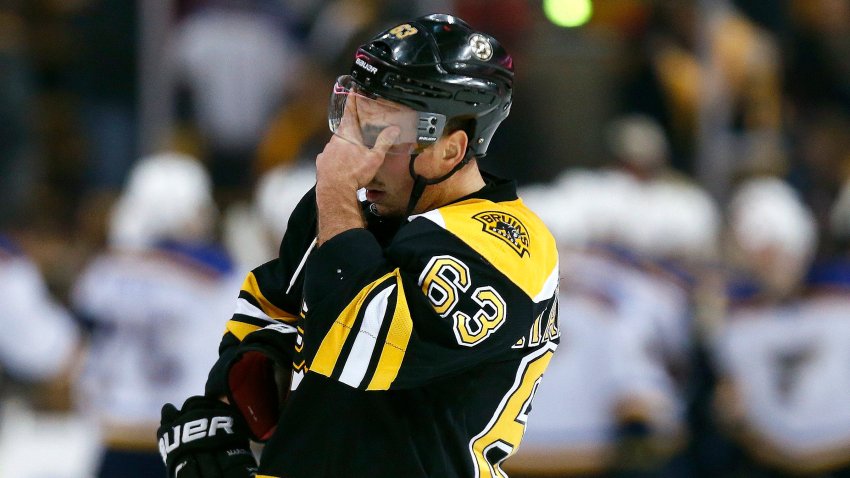 Boston Bruins’ Brad Marchand (63) holds his head after the St. Louis Blues defeated the Bruins 2-0 during an NHL hockey game in Boston, Tuesday, Dec. 22, 2015. (AP Photo/Michael Dwyer)