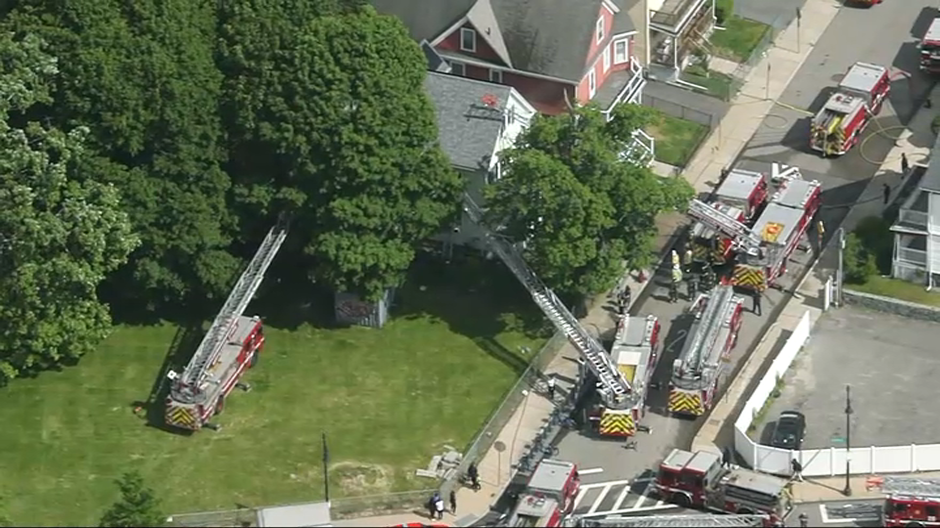 Boston firefighters battling a house fire in Dorchester on Thursday, May 25, 2023.