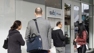Customers outside a Silicon Valley Bank branch in Beverly Hills, California, on March 13, 2023.