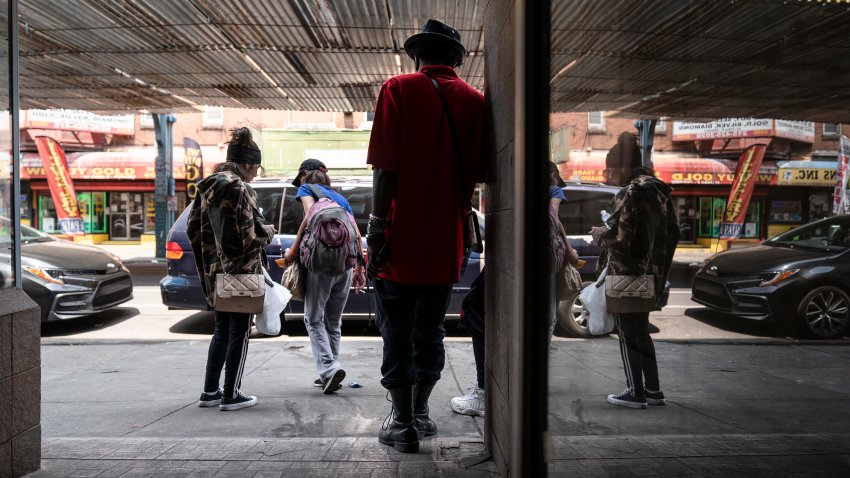 People gather outside the Savage Sisters’ community outreach storefront in the Kensington neighborhood of Philadelphia, Wednesday, May 24, 2023. Xylazine, a powerful animal sedative that’s moving through the illicit drug supply is complicating the U.S. response to the opioid crisis, causing gruesome skin wounds and scrambling longstanding methods for treating addiction and reversing overdoses. (AP Photo/Matt Rourke)