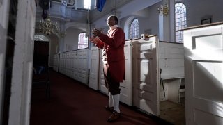 Actor Nathan Johnson, in the role of Cato, performs during a dress rehearsal of the play "Revolution's Edge" Monday, June 12, 2023, at Old North Church, in Boston's historic North End neighborhood.