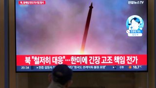 North Korea test-fired a ballistic missile off its east coast on Thursday, hours after South Korean and U.S. troops ended a fifth round of large-scale live-fire drills near the Koreas’ heavily fortified border. The letters read ” North Korea, launched ballistic missile to east coast.” (AP Photo/Lee Jin-man)