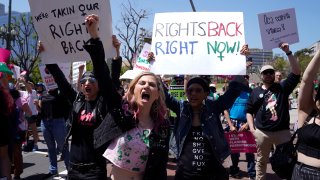 FILE – Supporters cheer up as Vice President Kamala Harris gives remarks at the Women’s March in Los Angeles Saturday, April 15, 2023. One year ago, the U.S. Supreme Court rescinded a five-decade-old right to abortion, prompting a seismic shift in debates about politics, values, freedom and fairness.