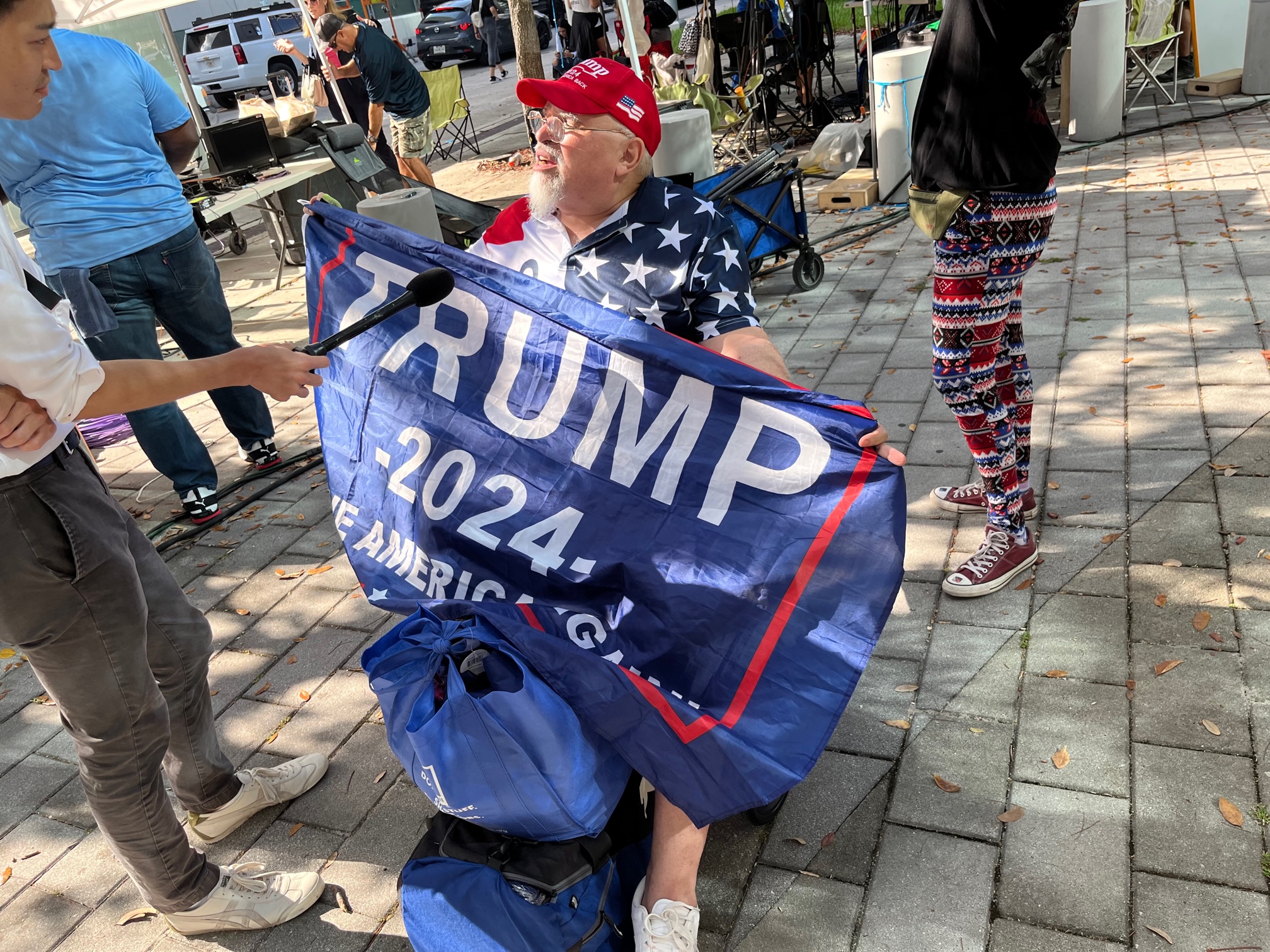 A supporter of former President Donald Trump demonstrates outside of the Wilkie D. Ferguson Jr. United States Courthouse in Miami, June 13, 2023.