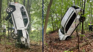 Two views of a crashed SUV off I-495 in Boxborough, Massachusetts, on Tuesday, June 13, 2023.