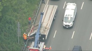 A truck carrying glass window panels that was involved in a crash on Interstate-93 in Boston on Tuesday, June 6, 2023.