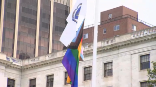 The Pride flag and the flag of Massachusetts being raised at the State House on Wednesday, June 7, 2023.