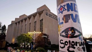 A menorah is tested outside the Tree of Life Synagogue in preparation for a celebration service at sundown on the first night of Hanukkah, Sunday, Dec. 2, 2018 in the Squirrel Hill neighborhood of Pittsburgh.