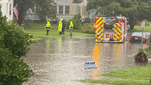 Firefighters are on Brace Road in West Hartford where flooding has closed the road.