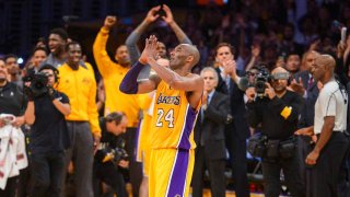 Kobe Bryant waves to fans after scoring 60 points in the final game of his career against the against the Utah Jazz. April 13, 2016.