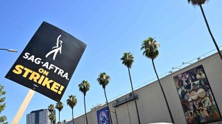 Atmosphere the picket line in support of the SAG-AFTRA and WGA strike at Warner Bros. on July 27, 2023 in Los Angeles, California.