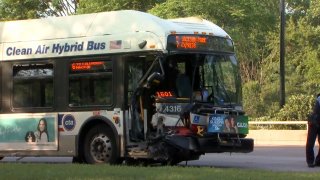 A Chicago Transit Authority bus sits on the side of DuSable Lake Shore Drive after a vehicle collided with its front-right fender Sunday morning. 16 people were hurt in the crash.