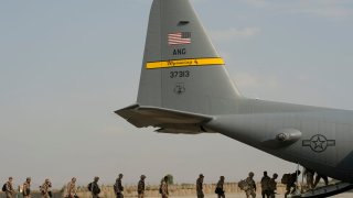 US troops along are seen loading into a C-130 Hercules cargo plane at Forward Operating Base Salerno, Khost province, Afghanistan.