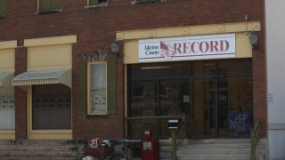 The offices of the Marion County Record weekly newspaper sit across the street from the Marion County, Kansas, courthouse, Monday, Aug. 21, 2023, in Marion, Kansas.