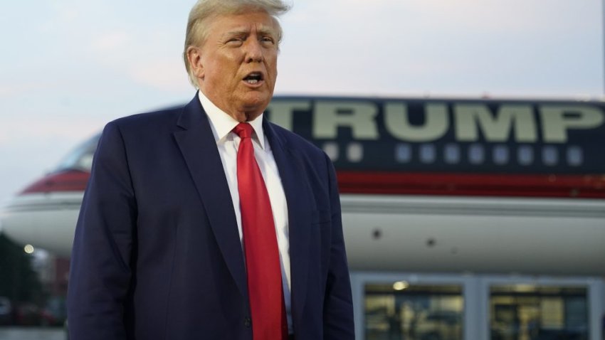 Former President Donald Trump speaks with reporters before departure from Hartsfield-Jackson Atlanta International Airport, Thursday, Aug. 24, 2023, in Atlanta.