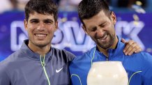 MASON, OHIO - AUGUST 20: Carlos Alcaraz of Spain and Novak Djokovic of Serbia pose with their trophies after the final of the Western & Southern Open at Lindner Family Tennis Center on August 20, 2023 in Mason, Ohio. (Photo by Matthew Stockman/Getty Images)