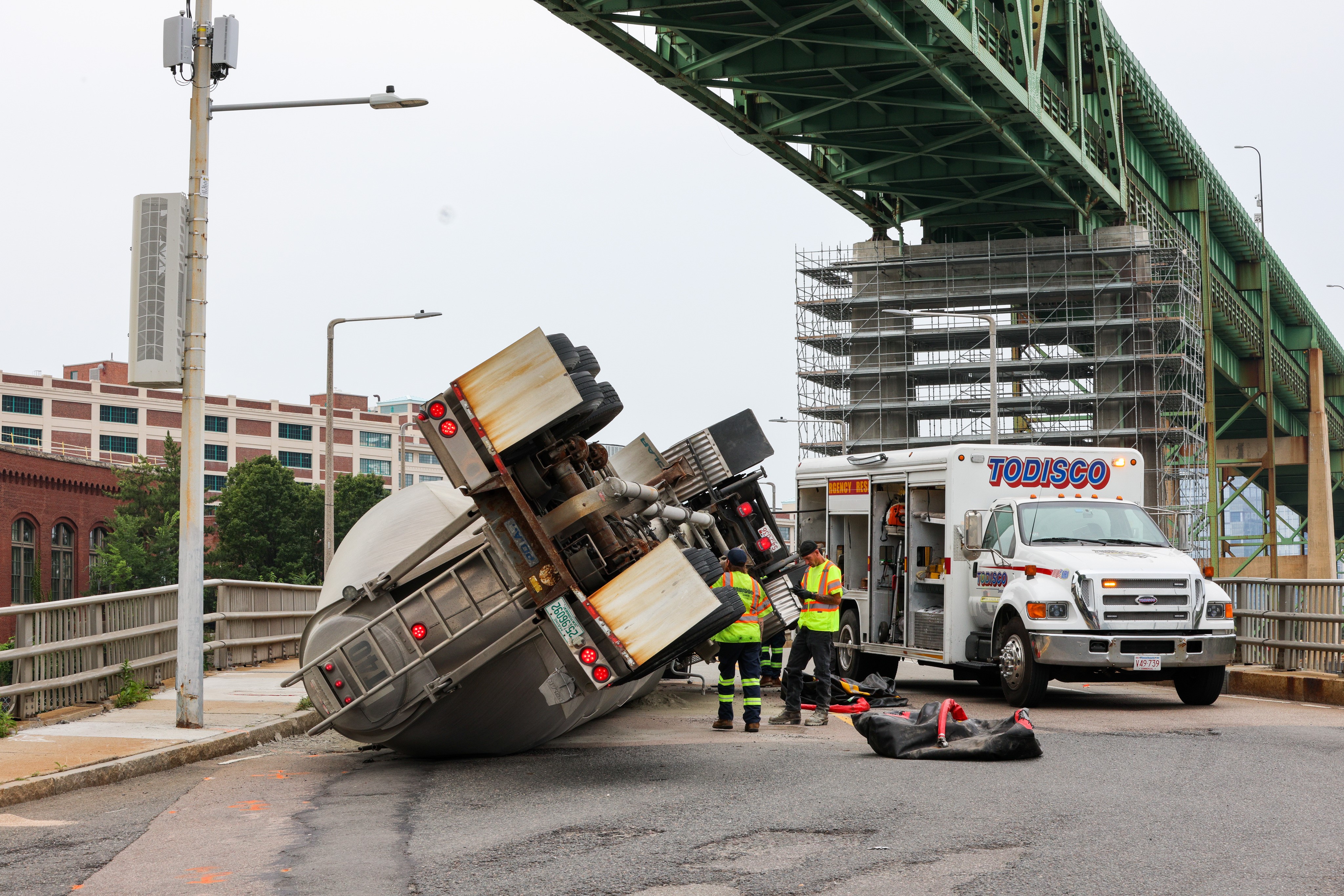 A rolled-over truck on Terminal Street under the Tobin Bridge in Boston's Charlestown neighborhood on Monday, Aug. 7, 2023.