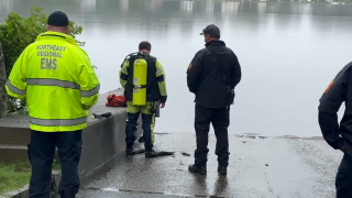 A dive team at Chebacco Lake in Hamilton, Massachusetts, where the body of a missing man from Wrentham was found on Wednesday, Aug. 30, 2023.