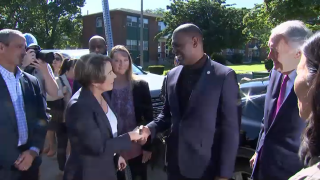 Massachusetts Gov. Maura Healey greets U.S. EPA Administrator Michael Regan at a housing complex in Boston's Dorchester neighborhood on Wednesday, Aug. 23, 2023.