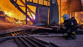 In this photo provided by the Ukrainian Emergency Service, emergency services personnel work to extinguish a fire following a Russian attack in Lviv, Ukraine, Tuesday, Sept. 19, 2023.