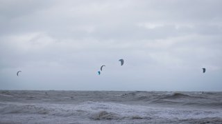 Several kiteboarders brave the storm surge of Tropical Storm Ophelia