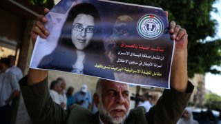 Members of the Palestinian Prisoners Committee hold a rally outside the International Committee of the Red Cross (ICRC) office in Gaza City on July 17, 2023, demanding the Iraqi government to include Palestinian prisoners in Israeli jails in the exchange for Israeli-Russian academic Elizabeth Tsurkov.