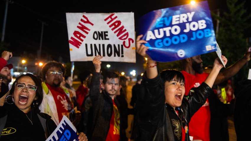 Members of the UAW (United Auto Workers) picket and hold signs outside of the UAW Local 900 headquarters across the street from the Ford Assembly Plant in Wayne, Michigan on September 15, 2023. The US auto workers’ union announced the start of a strike at three factories just after midnight on Friday, September 15, as a deadline expired to reach a deal with employers on a new contract.
“Tonight, for the first time in our history, we will strike all three of the Big Three at once,” UAW President Shawn Fain said in a webcast two hours before the midnight contract expiration at the three major automakers.