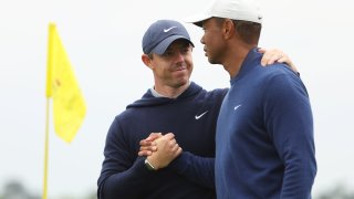 Tiger Woods of the United States and Rory McIlroy of Northern Ireland look on from the 11th tee during a practice round prior to the 2023 Masters Tournament at Augusta National Golf Club on April 03, 2023 in Augusta, Georgia. 