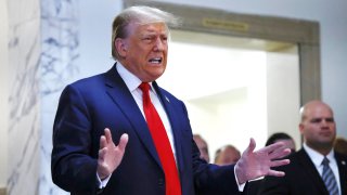 Former President Donald Trump speaks to members of the media while arriving for the second day of his civil fraud trial in New York on Oct. 3, 2023.