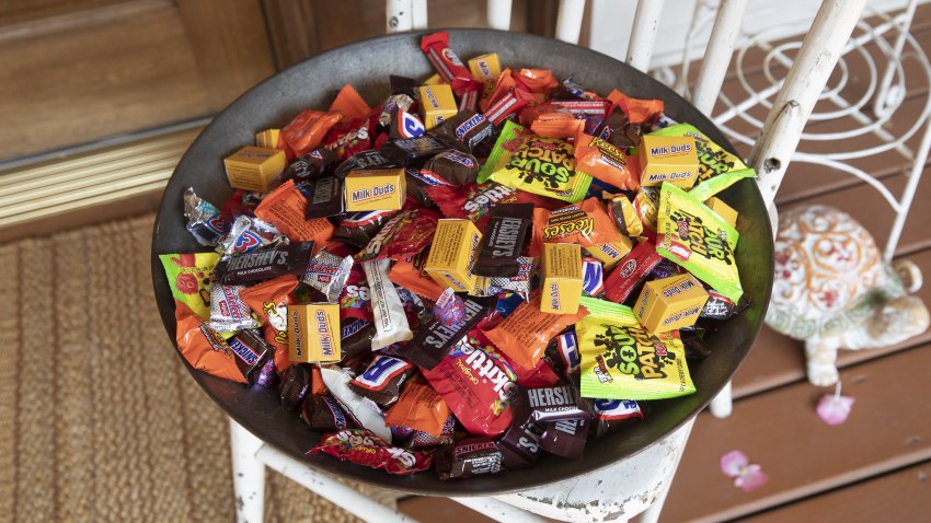 Mars Inc., Hershey Co., and Mondelez International Inc. brand Halloween candy is displayed for a photograph in a bowl in Tiskilwa, Illinois, U.S., on Sunday, Sept. 20, 2020. Costume-sellers appear to be facing one of their scariest fall seasons in a long time, even as confectioners could see sales hold steady from past years, with some candy brands even expecting an uptick.