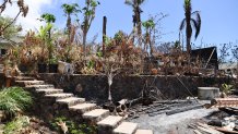 The ruins of a home destroyed by a deadly August wildfire lay outside the boundary of a Hawaiian homestead community in Lahaina, Hawaii, on Friday, Sept. 1, 2023.