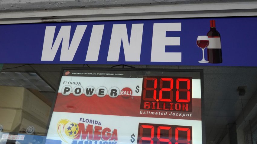 A sign shows the estimated jackpot for Powerball in the window of a store on October 04, 2023 in Miami, Florida.