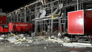 A damaged mail depot building following missile strikes in Kharkiv region, Ukraine, on October 21.