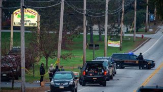 Police presence at Schemengees Bar, one of the locations where the mass shooting occured, on Thursday, Oct. 26.