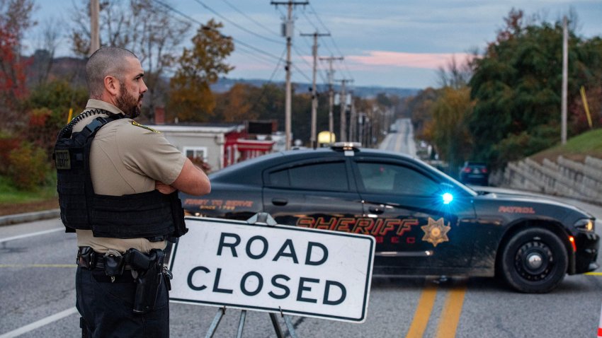 Police presence at Schemengees Bar where a mass shooting occurred yesterday in Lewiston, Maine on October 26, 2023. A massive manhunt was under way on October 26 for a gunman who a local official said killed at least 22 people and wounded dozens more in mass shootings in the US state of Maine, the deadliest such incident this year. (Photo by Joseph Prezioso / AFP) (Photo by JOSEPH PREZIOSO/AFP via Getty Images)