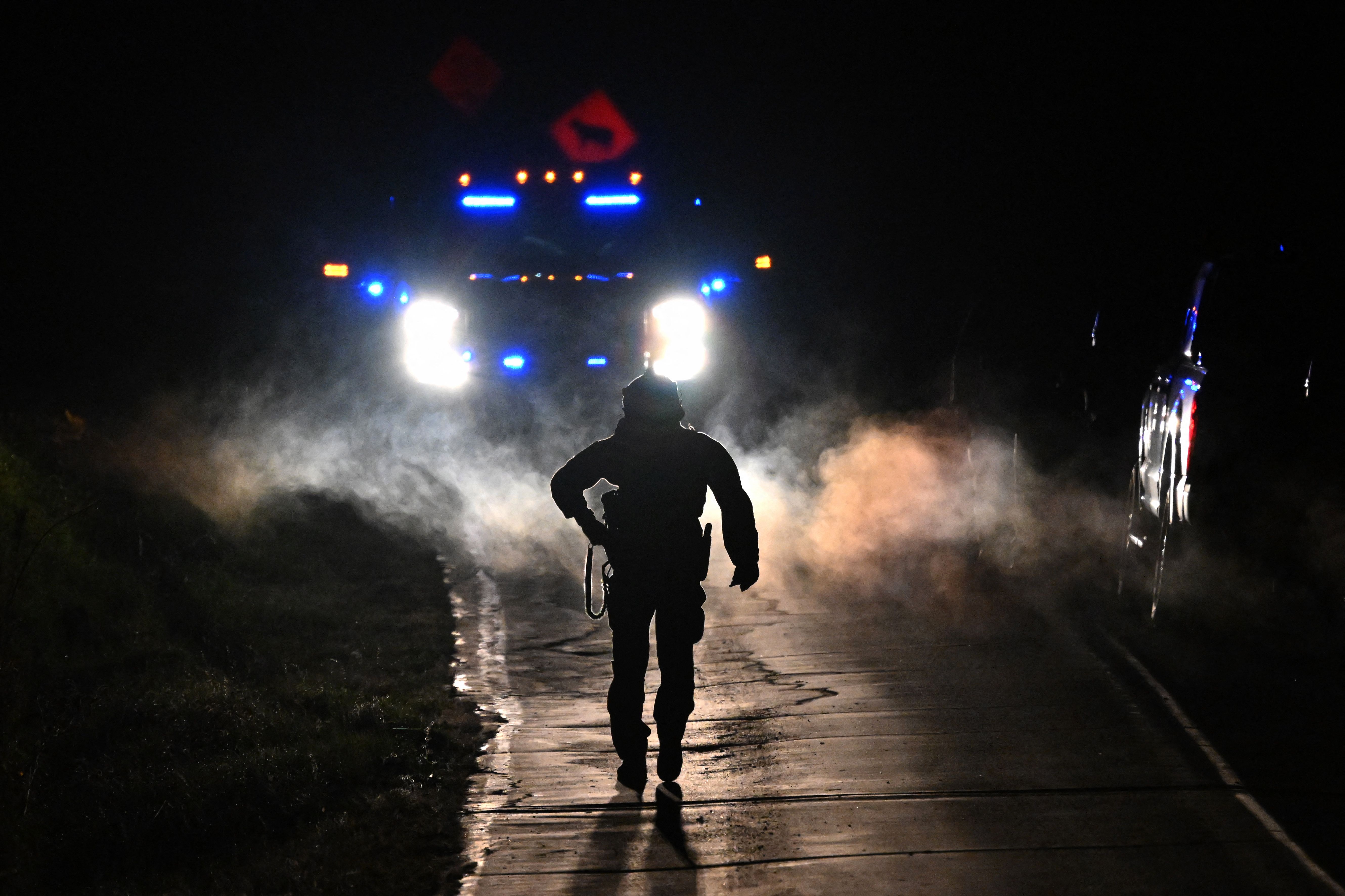 Law enforcement are seen outside the home of suspect Robert Card’s father and brother in Bowdoin, Maine on Thursday, Oct. 26, 2023.