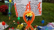 Lewiston, ME - October 30: A makeshift memorial grows outside of Schemengees Bar & Grille, one of two locations where a mass shooting killed 18 people. (Photo by Jessica Rinaldi/The Boston Globe via Getty Images)