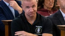 Aidan Kearney, the blogger known as Turtleboy, sits behind William and Janet Read as their daughter, Karen Read, appeared in Norfolk Superior Court in Dedham, Massachusetts, on Sept. 15, 2023.