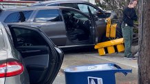 An apparent car crash in Malden, Massachusetts, on Thursday, Oct. 19, 2023, left several vehicles damaged and traffic lights and a mailbox knocked over.