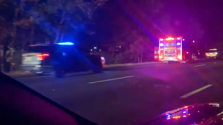 First responders on the scene of a fatal car crash on I-495 in Plainville, Massachusetts, early on Tuesday, Oct. 10, 2023.