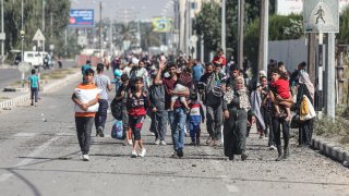 Palestinians fleeing Gaza City towards the southern areas ride on a road on November 7, 2023, amid the ongoing battles between Israel and the Palestinian Islamist group Hamas. 