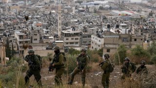 Israeli soldiers are seen during a military operation in the Balata refugee camp, West Bank.